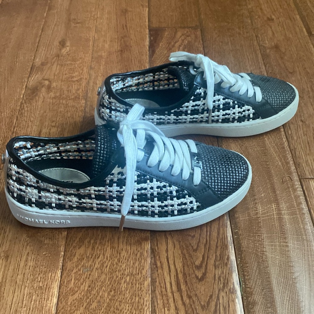 Michael Kors updated athletic shoe. Size 6M; black/ white  with silver accents.
